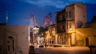 Panoramic view of Baku, from the old city looking at Flame Towers at night